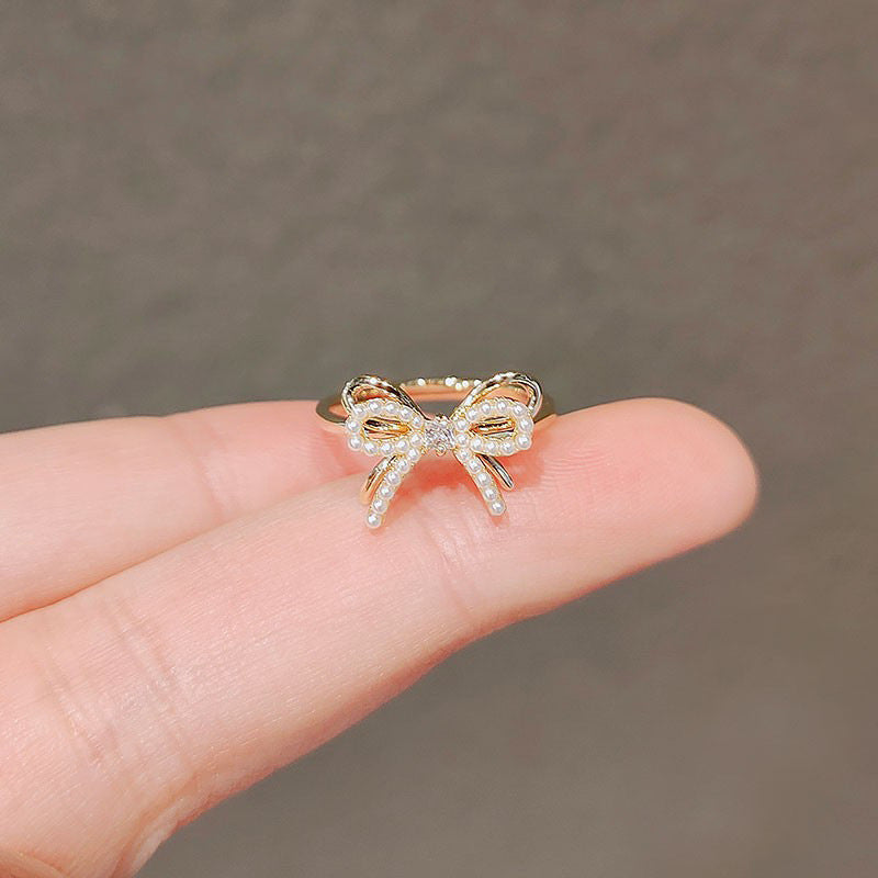 Zircon Bow Rings